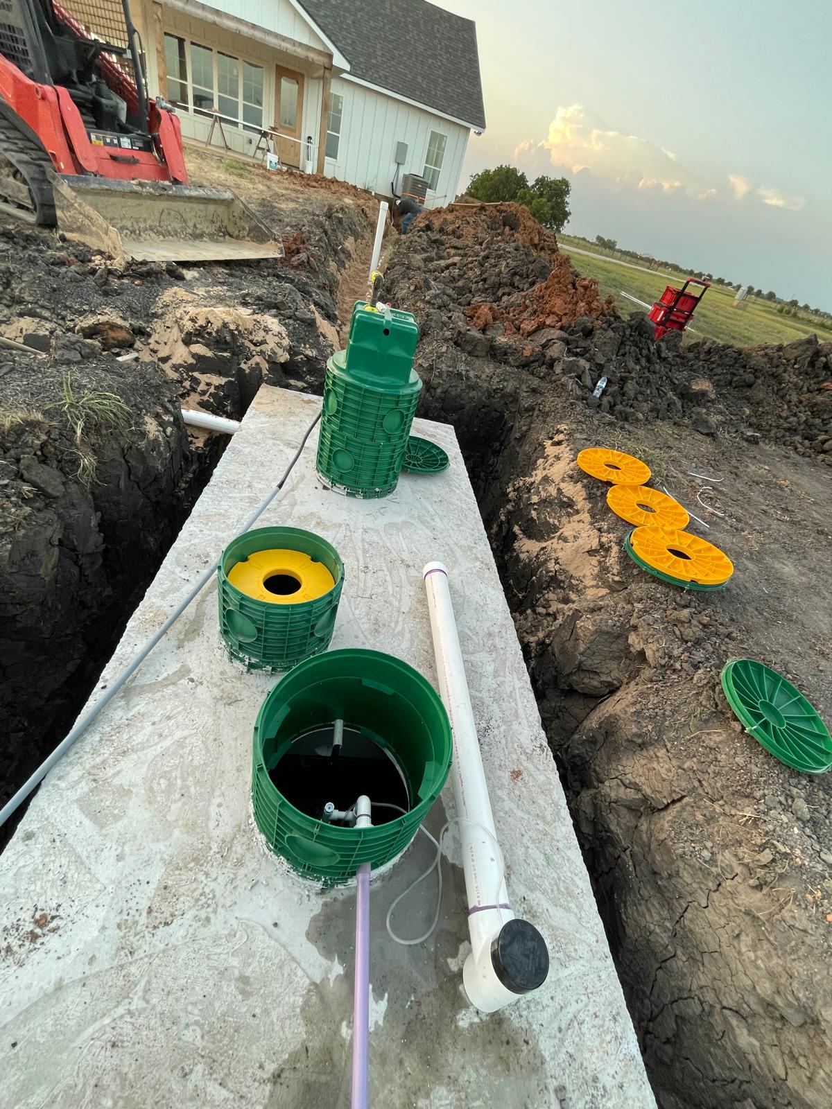 Septic tank with risers