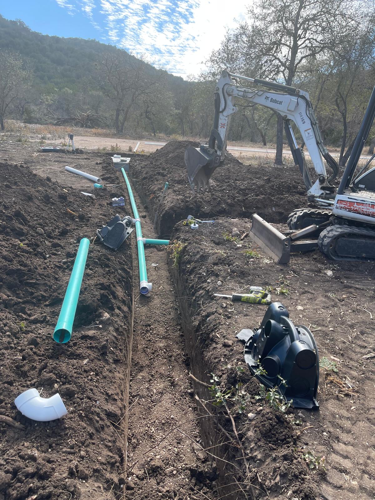 Septic piping with excavator
